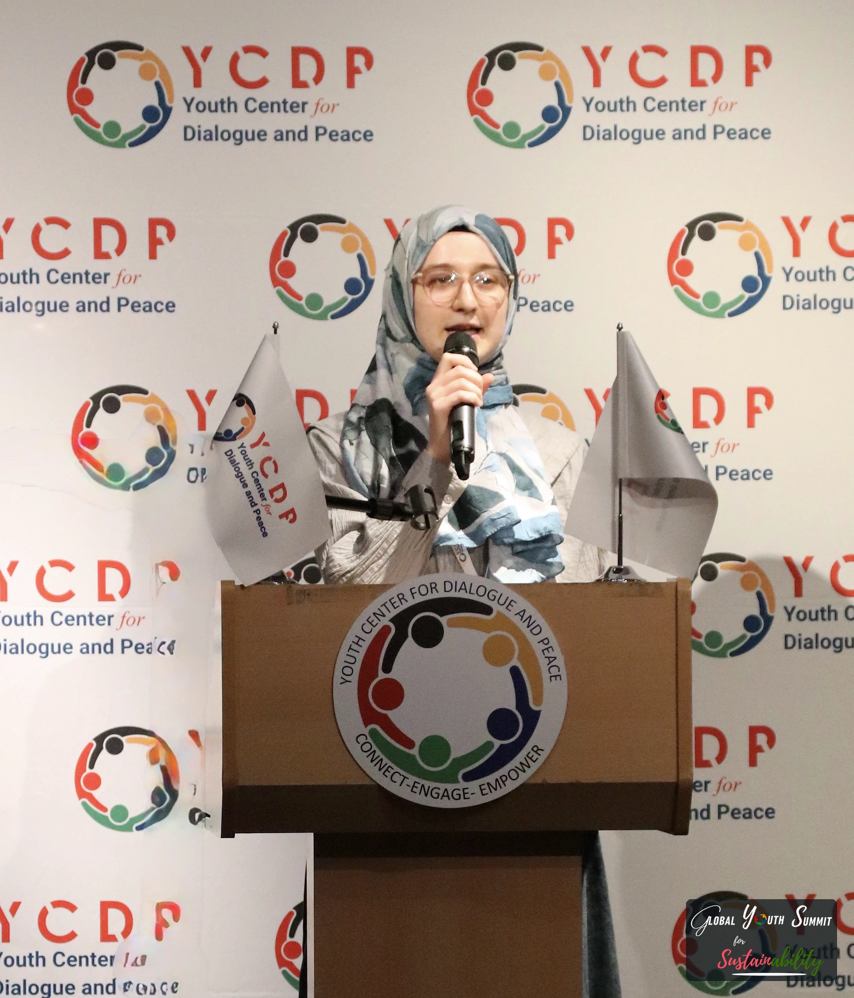 Delegate presenting a youth solution at the podium