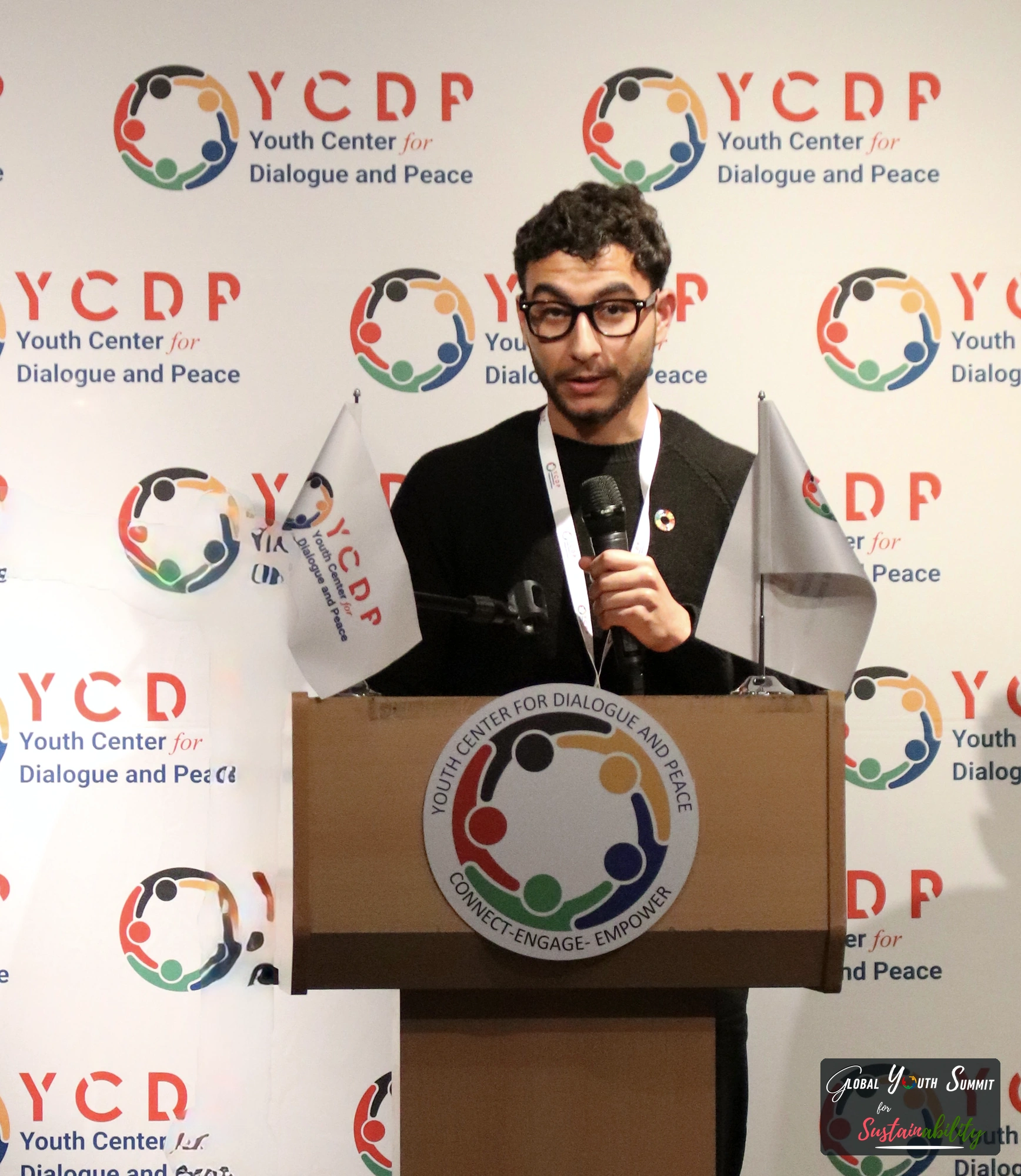 Delegate presenting a youth solution at the podium