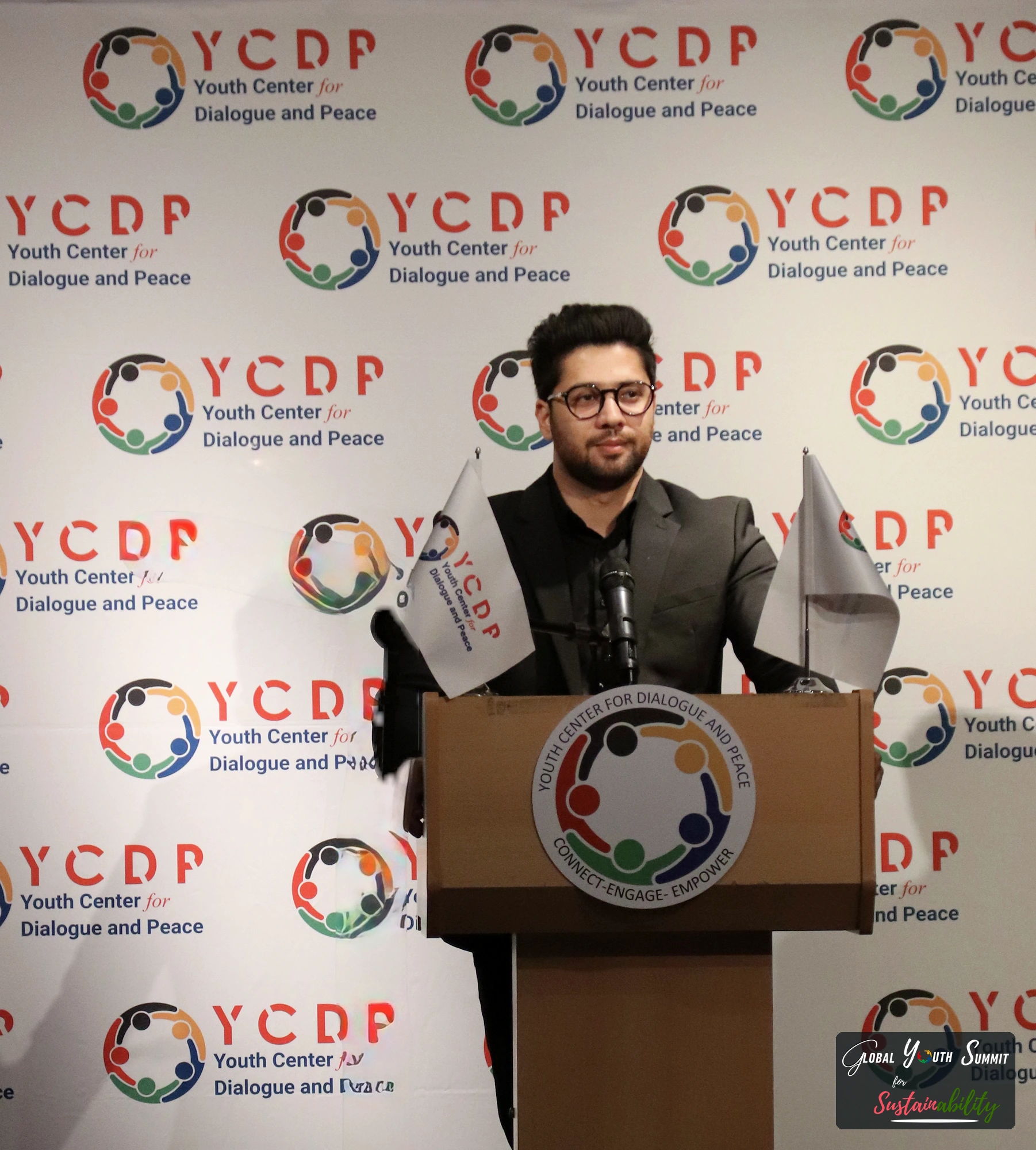 Delegate presenting a youth solution at the podium