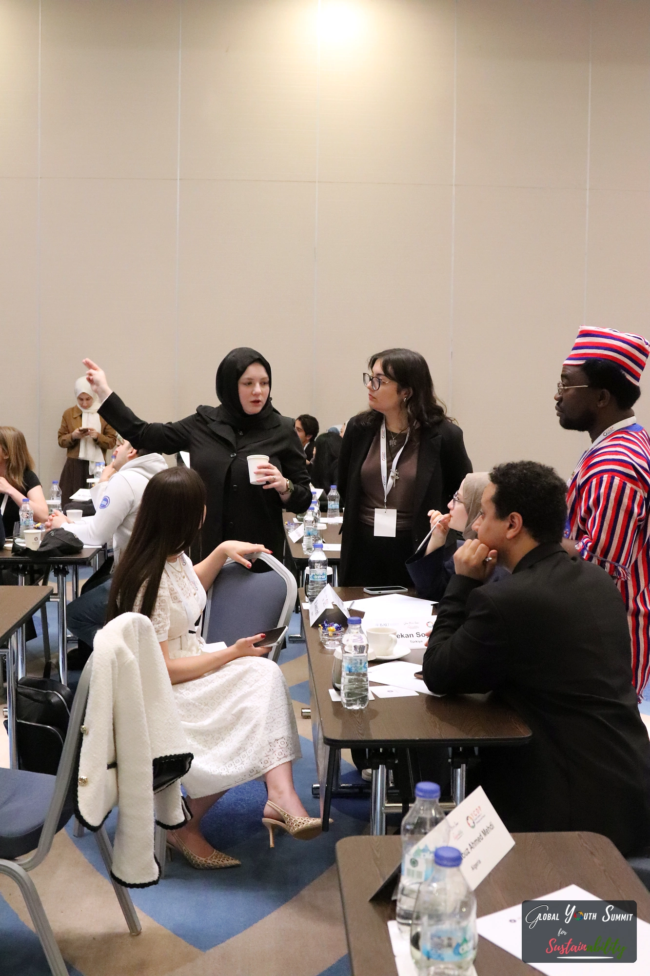 Delegates exchanging ideas in a working group